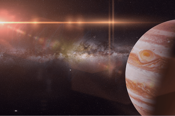 Darstellung des Planeten Jupiter im Weltraum mit Blick auf die Milchstraße – symbolisiert astrologisches Wachstum, Fülle und persönliche Expansion im Jupiter-Jahr 2025.
